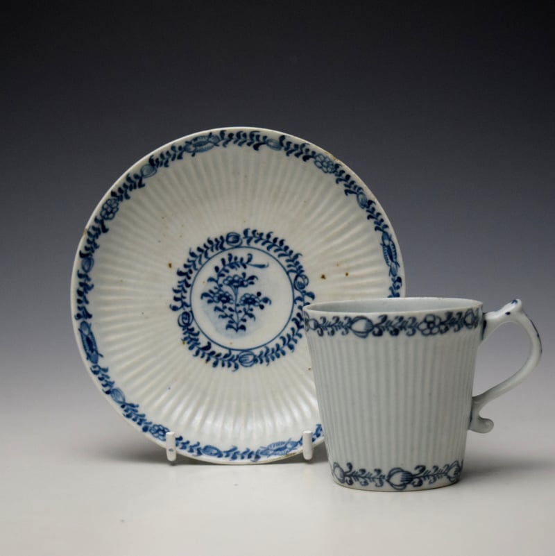 Early Flower Bud and Leaf Border Pattern Reeded Bucket Shaped Coffee Cup and Saucer c1762-65