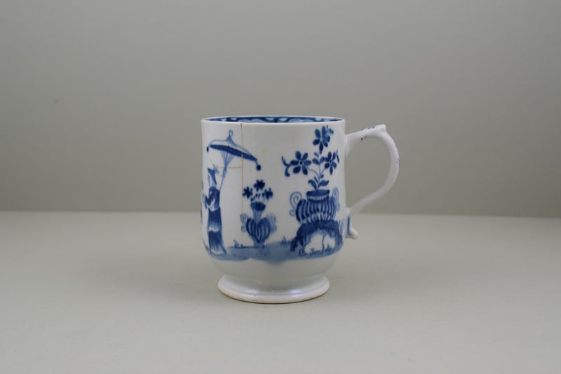 Very Rare Early Lowestoft Porcelain Lady and Parasol Pattern Mug, C1762-65.