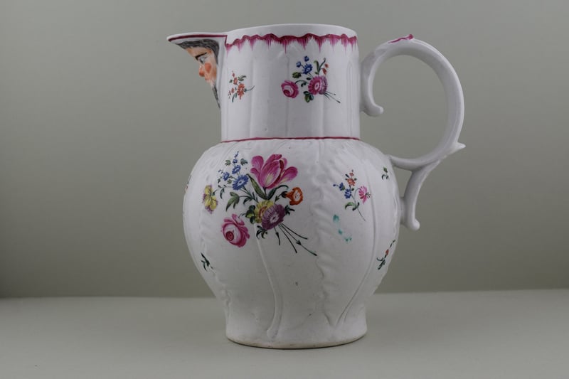 Baddeley Littler Porcelain Mask Spout jug, C1770. a