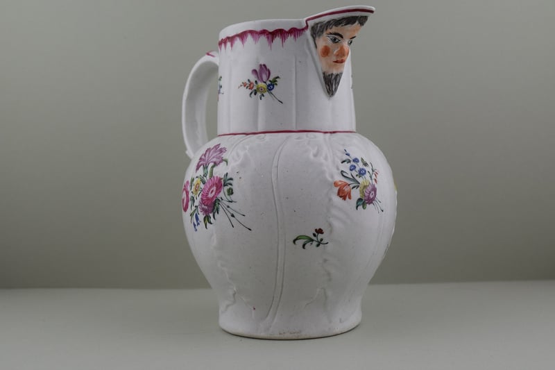 Baddeley Littler Porcelain Mask Spout jug, C1770. d