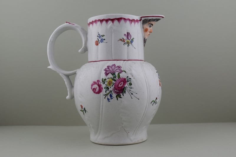 Baddeley Littler Porcelain Mask Spout jug, C1770. e