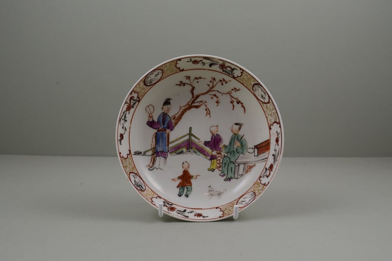 Mandarin Boy Playing with a Dog Pattern Saucer, C1785-95.