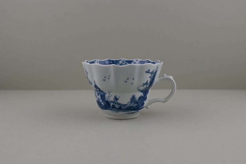 Very Rare The Departing Chinaman Pattern Chocolate Cup and Saucer, C1757. (I.B.33A) a (2)
