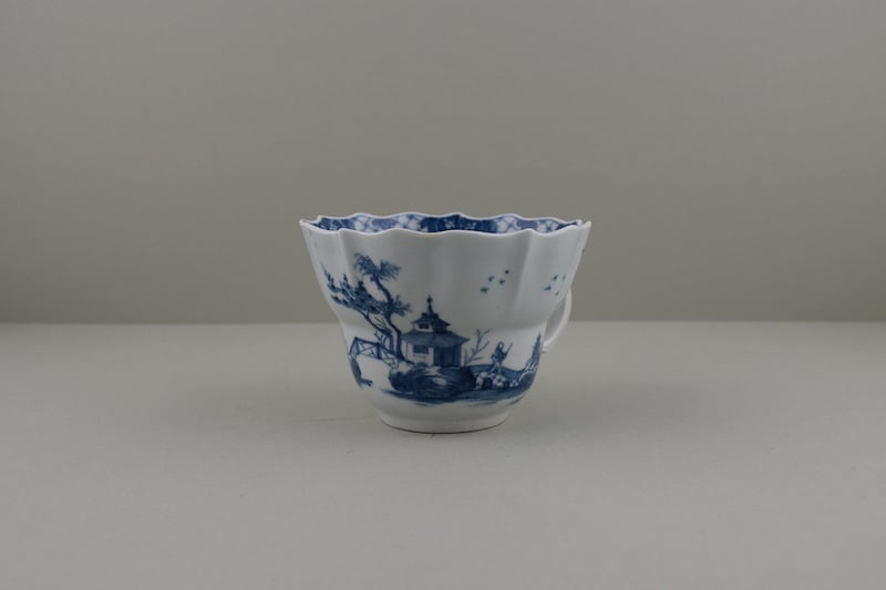 Very Rare The Departing Chinaman Pattern Chocolate Cup and Saucer, C1757. (I.B.33A) a (3)